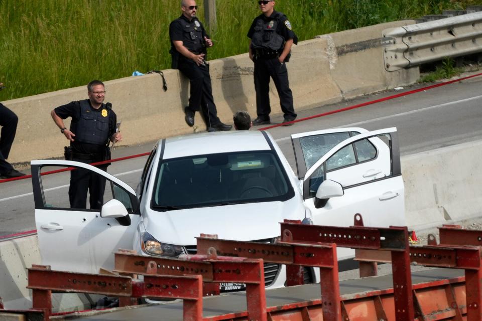 Police investigate a vehicle after all northbound and southbound lanes on Interstate 43 from Capitol Drive to Locust Street were closed due to a police investigation in Milwaukee on June 20.