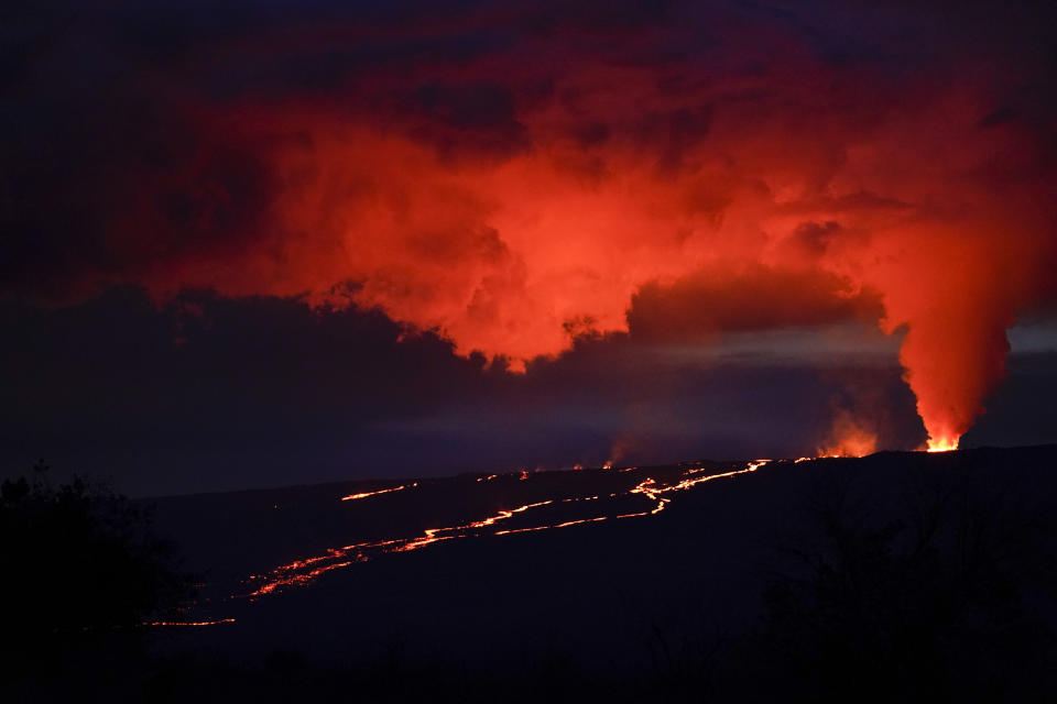 Lava erupts from Hawaii's Mauna Loa volcano Wednesday, Nov. 30, 2022, near Hilo, Hawaii. (AP Photo/Gregory Bull)