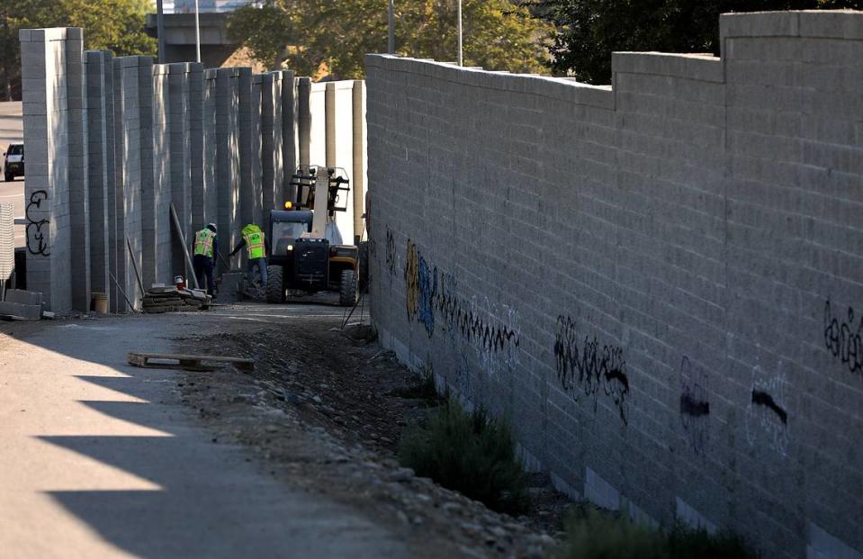 Construction workers expect to finish the wall project next month.