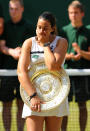 France's Marion Bartoli celebrates with her trophy after defeating Germany's Sabine Lisicki in the Ladies' Singles Final during day twelve of the Wimbledon Championships at The All England Lawn Tennis and Croquet Club, Wimbledon.