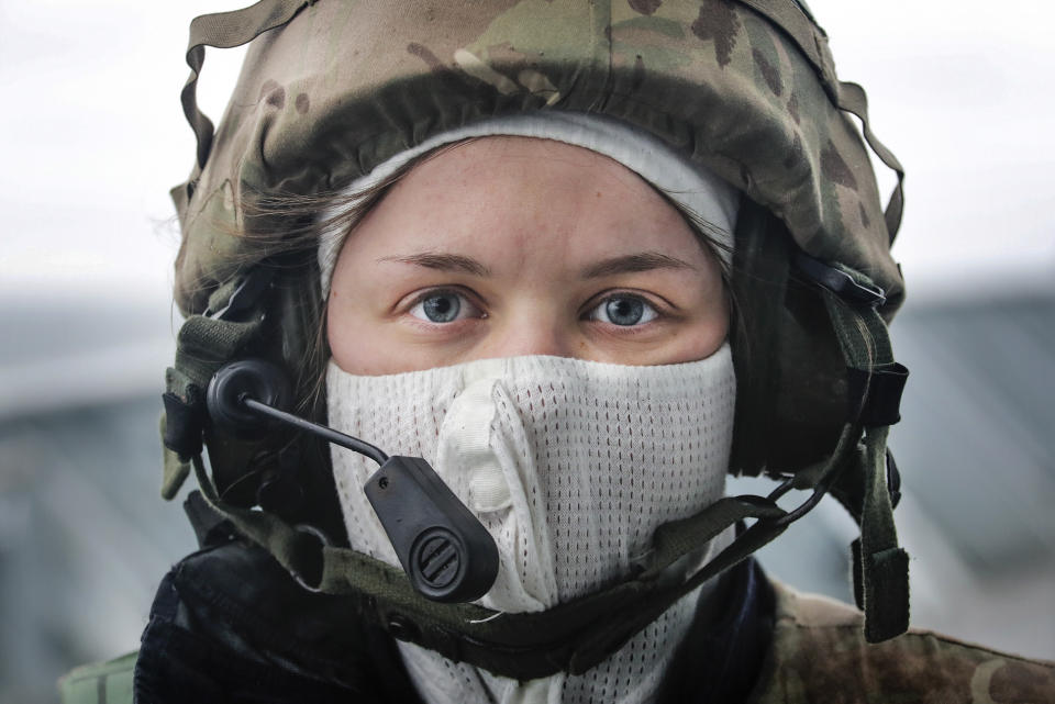 Image of a female sailor onboard HMS Albion, taking part in a simulated attack exercise (Picture: UK MOD/Crown 2019)