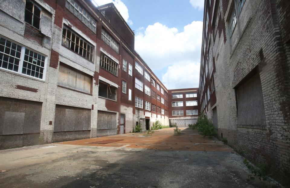 This area between former Hoover Co. factories will be a courtyard separating apartment buildings in North Canton's Hoover District. The project got a boost Wednesday when it received Ohio Historic Preservation Tax Credits.