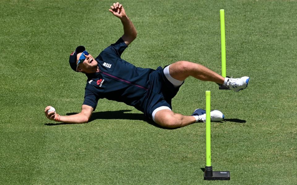 Joe Root of England takes a catch during a Net Session at Newlands Cricket Ground  - GETTY IMAGES