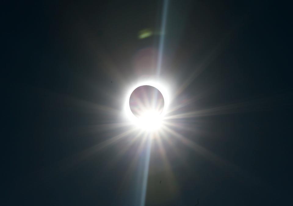 FILE - A solar eclipse is observed over Chile in 2019. A similar eclipse will be visible over many parts of the U.S. on April 8, with Georgians expecting a partial eclipse.