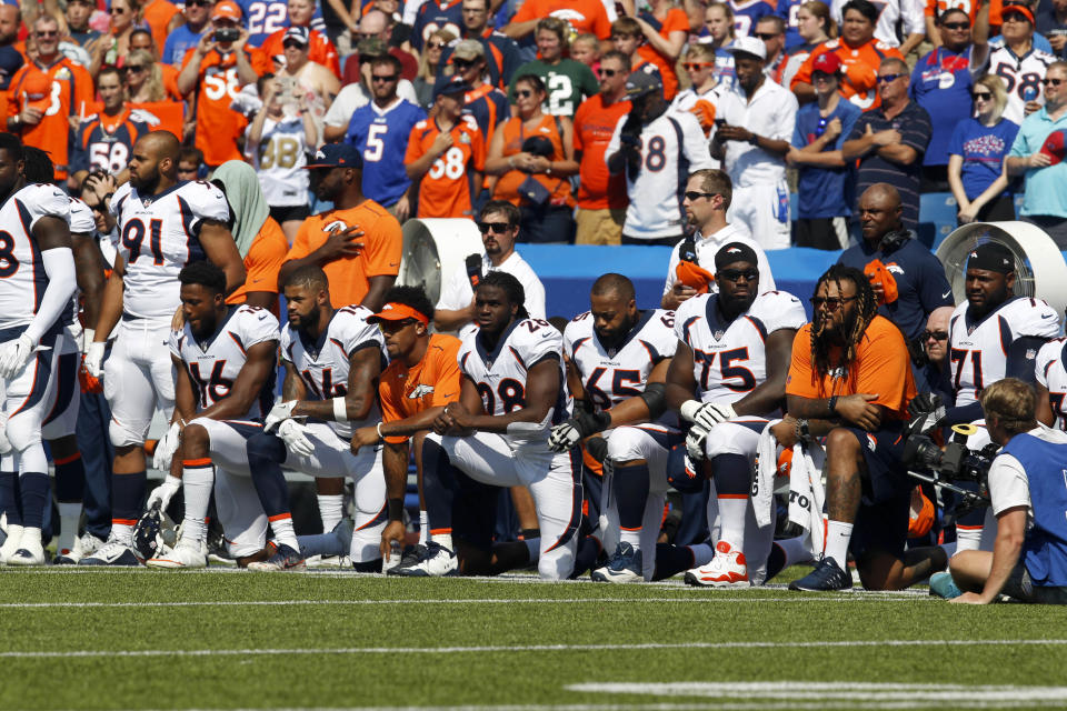 <p>Denver Bronco players kneel in protest during the National Anthem before a game against the Buffalo Bills at New Era Field. Mandatory Credit: Timothy T. Ludwig-USA TODAY Sports </p>