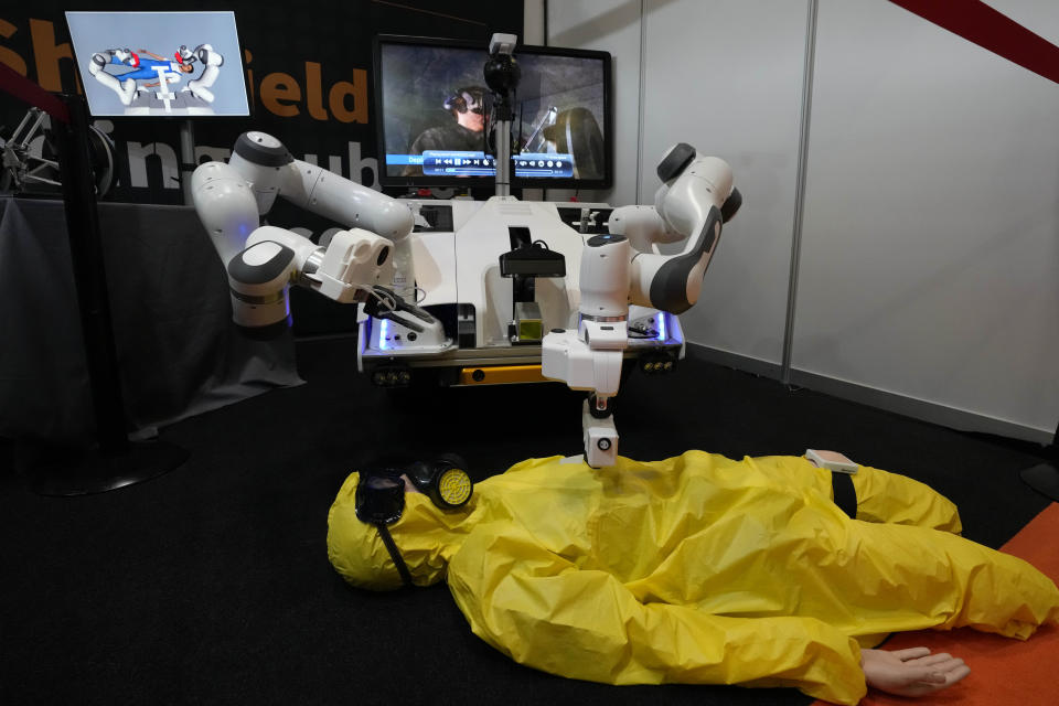 A controlled robot performs first aid during the International Conference on Robotics and Automation ICRA in London, Tuesday, May 30, 2023.The 2023 ICRA brings together the world's top academics, researchers, and industry representatives to show the newest developments. (AP Photo/Frank Augstein)