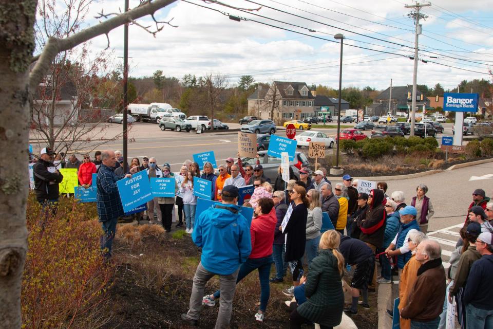 A crowd gathers for Saturday's "Justice for Jay" event outside Bangor Savings Bank, calling for the bank to help provide a home for Jay Lanni. The bank is a trustee on his father's trust they say was meant to care for Jay, who lives with schizophrenia.