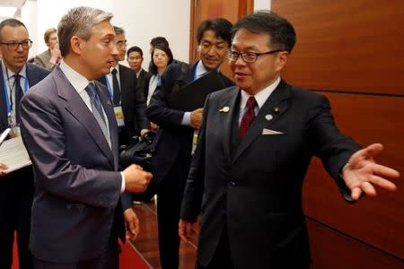 Japan's Trade Minister Hiroshige Seko (R) talks with Canada's International Trade Minister Francois-Philippe Champagne after their bilateral talk during the APEC Ministers Responsible For Trade (APEC MRT 23) meeting in Hanoi, Vietnam May 20, 2017. REUTERS/Kham