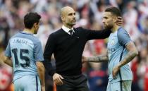 Britain Football Soccer - Arsenal v Manchester City - FA Cup Semi Final - Wembley Stadium - 23/4/17 Manchester City manager Pep Guardiola, Jesus Navas and Nicolas Otamendi look dejected after the match Action Images via Reuters / Carl Recine Livepic