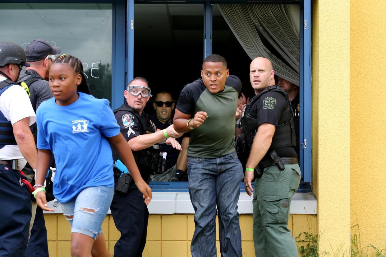 Students participate in a mass casualty exercise at an elementary school in Clearwater, Fla. 