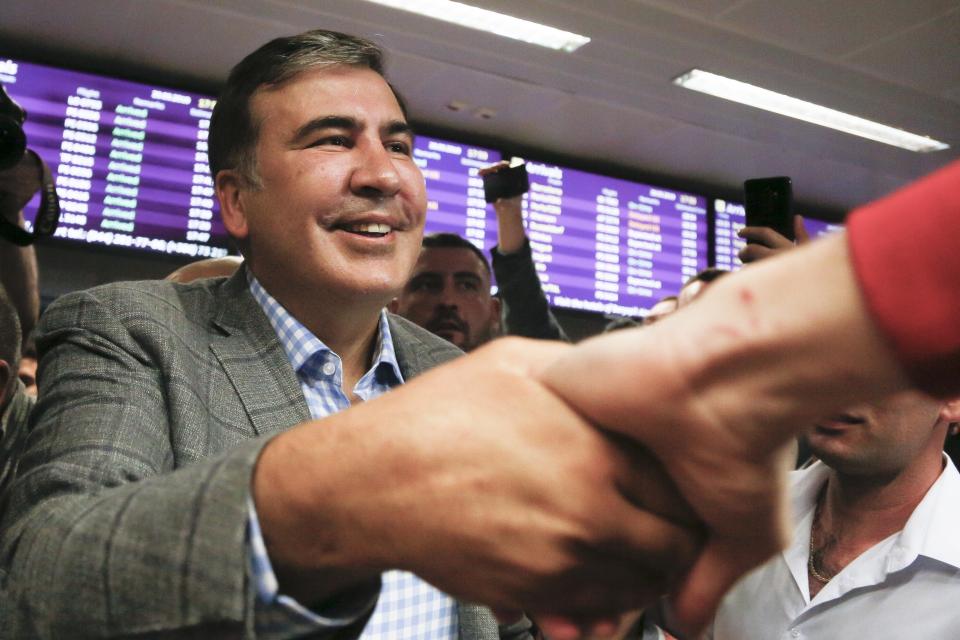FILE - In this May 29, 2019, file photo, Georgia's former President Mikheil Saakashvili greets supporters upon arrival at Boryspil Airport, outside Kyiv, Ukraine. Georgia Prime Minister Irakli Garibashvili announced Friday, Oct. 1, 2021, that Saakashvili was been arrested. The announcement came about 18 hours after Saakashvili, who was convicted in absentia and has lived in Ukraine in recent years, posted on Facebook that he had returned to the country. (AP Photo/Efrem Lukatsky, File)
