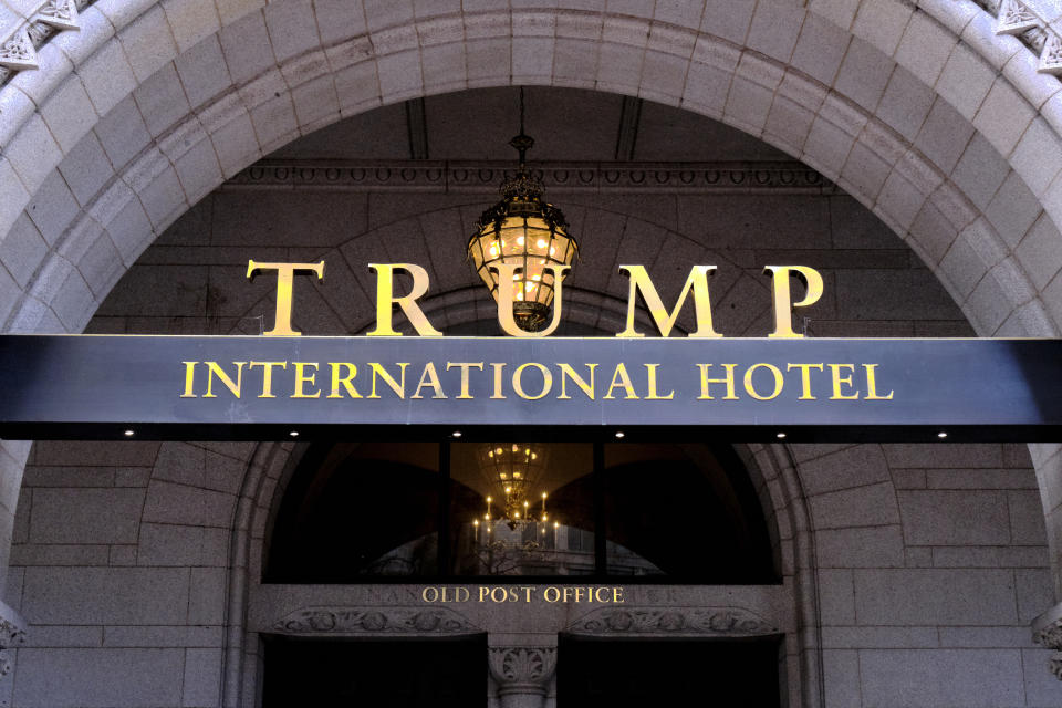 FILE- This March 11, 2019 file photo, shows the north entrance of the Trump International in Washington D.C. A federal appeals court has ordered the dismissal of a lawsuit accusing President Donald Trump of illegally profiting off the presidency. In a significant legal victory for Trump, a three-judge panel of the 4th U.S. Circuit Court of Appeals on Wednesday, July 10, 2019, overturned a ruling by a federal judge in Maryland who ruled last year that the lawsuit could move forward. (AP Photo/Mark Tenally, File)