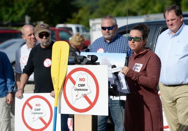 At a 2018 rally in Augusta, Maine, Kimberly Lyman, a whitewater rafting guide, speaks out against CMP's New England Clean Energy Connect, a 145-mile transmission line through Maine to bring electricity to Massachusetts residents. (Photo: Portland Press Herald via Getty Images)