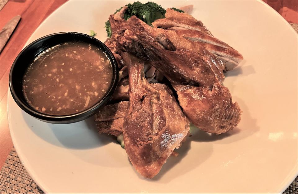 At Krua Thai in Stuart, the tender and delectable crispy duck was served with a delightful sauce on the side.