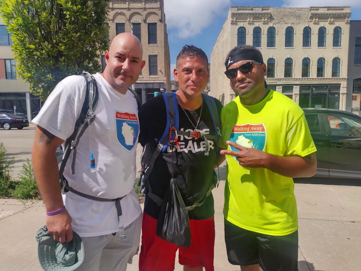 Cudahy resident Greg Studzinski (center) walked away from addiction by walking 136 miles from Green Bay to Cudahy over five days in early September. A few people like his friend John Leanna (left) and cousin James Brown (right) joined him at various points of his journey.