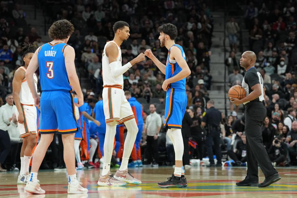 Jan 24, 2024; San Antonio, Texas, USA; San Antonio Spurs center Victor Wembanyama (1) and Oklahoma City Thunder forward Chet Holmgren (7) greet each other before the game at Frost Bank Center. Mandatory Credit: Daniel Dunn-USA TODAY Sports