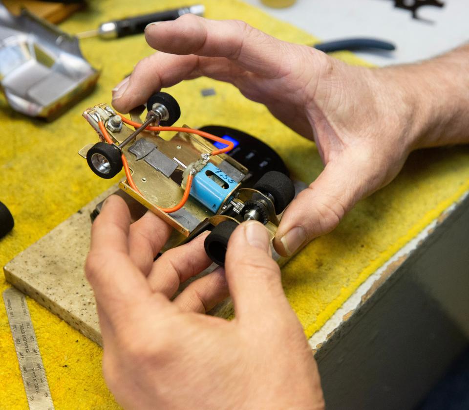 Ralph Middaugh of Massillon works on tweaking his slot car at Marks Model World and Slot Car in Massillon.