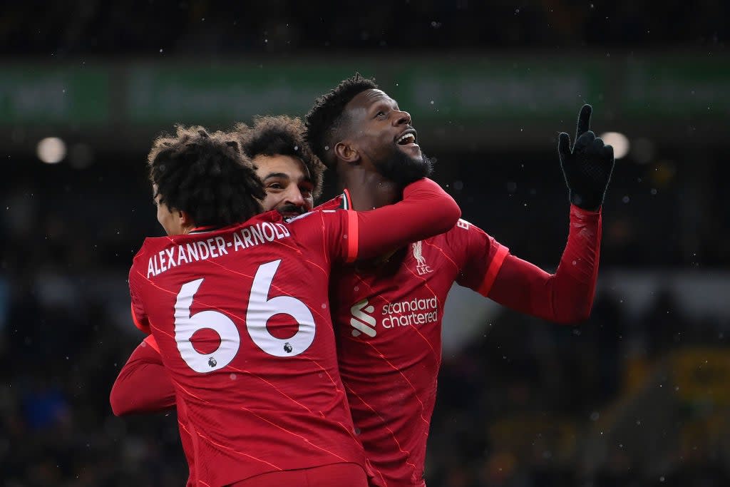 Divock Origi celebrates his winner with Trent Alexander-Arnold and Mohamed Salah  (Getty Images)