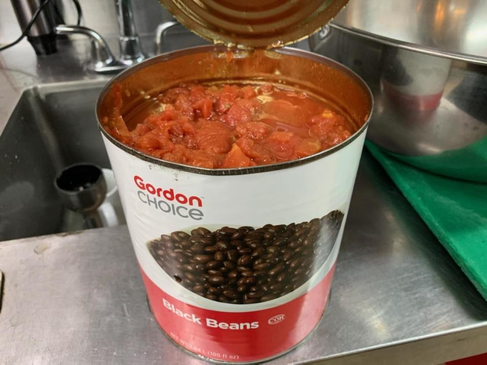 Red beans inside a ban labeled "Black beans"