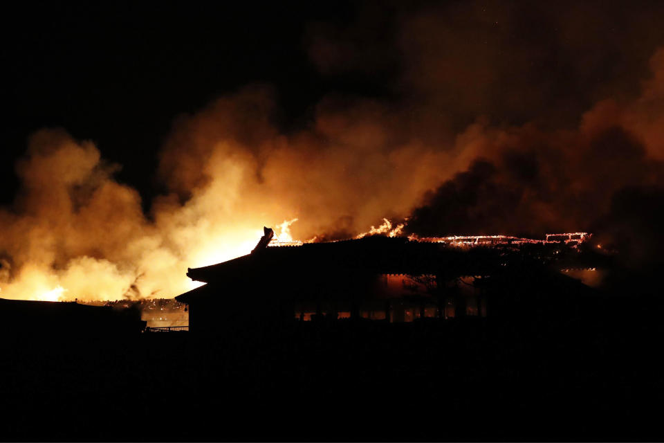 Smoke and flames rise from burning Shuri Castle in Naha, Okinawa, southern Japan, Thursday, Oct. 31, 2019. A fire broke out at the historic Shuri Castle on Japan’s southern island of Okinawa, nearly destroying it. (Jun Hirata/Kyodo News via AP)