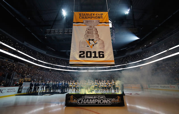 PITTSBURGH, PA - OCTOBER 13: Members of the Pittsburgh Penguins watch as the 2016 Stanley Cup Banner is raised prior to the game against the Washington Capitals at PPG Paints Arena on October 13, 2016 in Pittsburgh, Pennsylvania. (Photo by Gregory Shamus/NHLI via Getty Images)