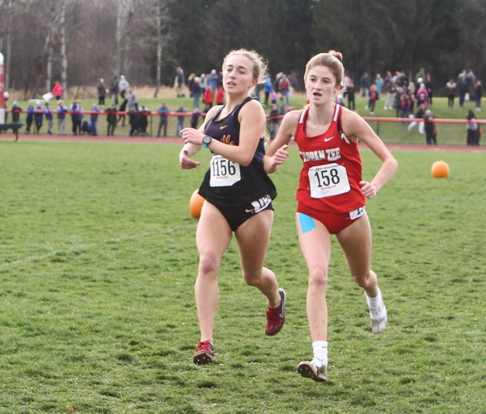 Tappan Zee's Cassidy Donovan (r) and Sayville's Mullane Baumiller (l) jokey for position right before the finish of the girls state Class B cross-country championship Nov. 11, 2023 in Verona, New York. Donovan edged Baumiller by .1 for 21st place out of 115 finishers.