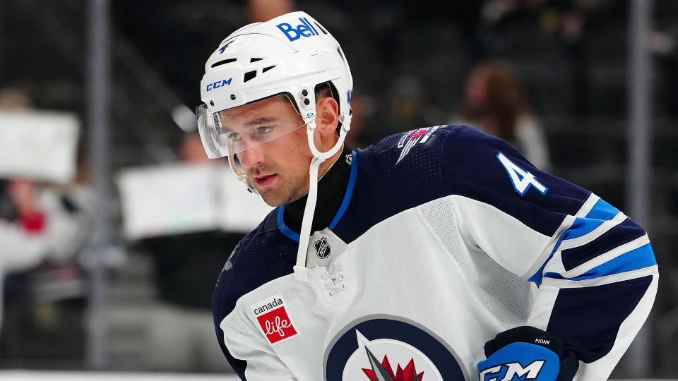 Jets defenseman Neal Pionk (4) was very close with the late Adam Johnson. (Stephen R. Sylvanie-USA TODAY Sports)