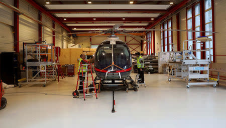 Mechanics prepare a prototype of a Marenco SH09 helicopter of Swiss manufacturer Marenco before a test flight in a hangar of the company's plant in Mollis, Switzerland October 13, 2017. REUTERS/Arnd Wiegmann