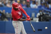 Cincinnati Reds' Aristides Aquino (44) connects for a two-run double against the Toronto Blue Jays during first-inning baseball game action in Toronto, Sunday, May 22, 2022. (Frank Gunn/The Canadian Press via AP)