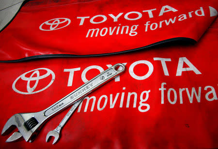 FILE PHOTO: Spanners are placed on a mat by mechanics for the photographer inside a Toyota service centre in Taipei March 3, 2010. REUTERS/Nicky Loh/File Photo