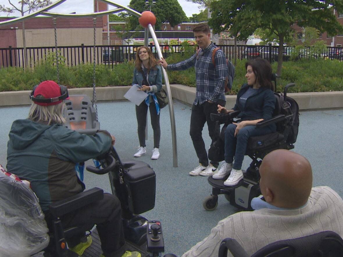 People with disabilities joined AccessNow and The Daniels Corporation to review and rank businesses and public spaces throughout the neighbourhood on their overall accessibility.  (Spencer Gallichan-Lowe/CBC - image credit)