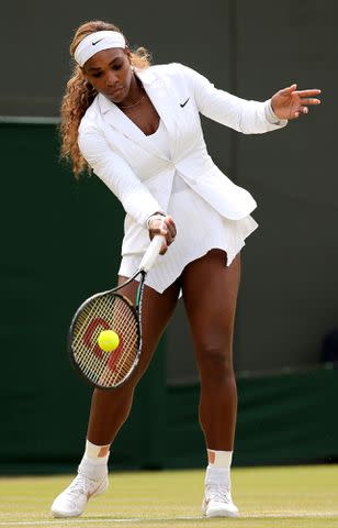 <p>ANDREW YATES/AFP/Getty</p> Serena Williams warming up at Wimbledon in 2014.