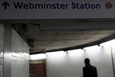 A commuter walks under a tube sign reading 'Webminster' after Amazon rebranded Westminster tube station as a marketing stunt in central London, Britain January 12, 2017. REUTERS/Stefan Wermuth TPX IMAGES OF THE DAY