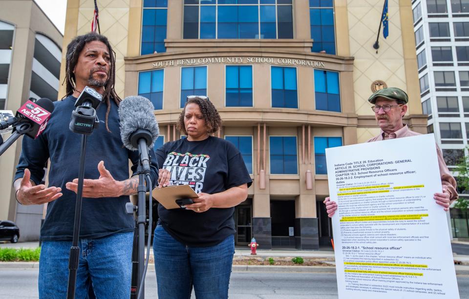 Darryl Heller, director of the IU South Bend Civil Rights Heritage Center, left, speaks next to Regina Williams-Preston, of Black Lives Matter South Bend, and Paul Mishler, of the Michiana Alliance Against Racist and Political Repression, during a press conference Wednesday about resource officers in schools..