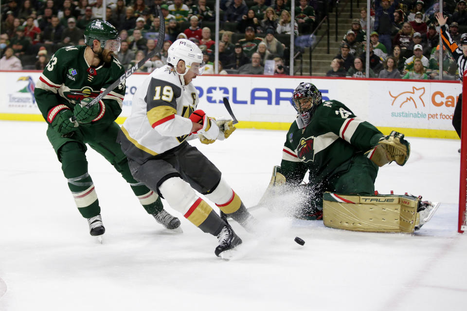 Vegas Golden Knights right wing Reilly Smith (19) is stopped on goal by Minnesota Wild goaltender Marc-Andre Fleury (29) with Wild defenseman Alex Goligoski (33) behind the play in the second period of an NHL hockey game Thursday, Feb. 9, 2023, in St. Paul, Minn. (AP Photo/Andy Clayton-King)