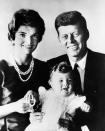 <p>Senator Kennedy and his wife, Jacqueline, smile for a portrait with a young Caroline. </p>