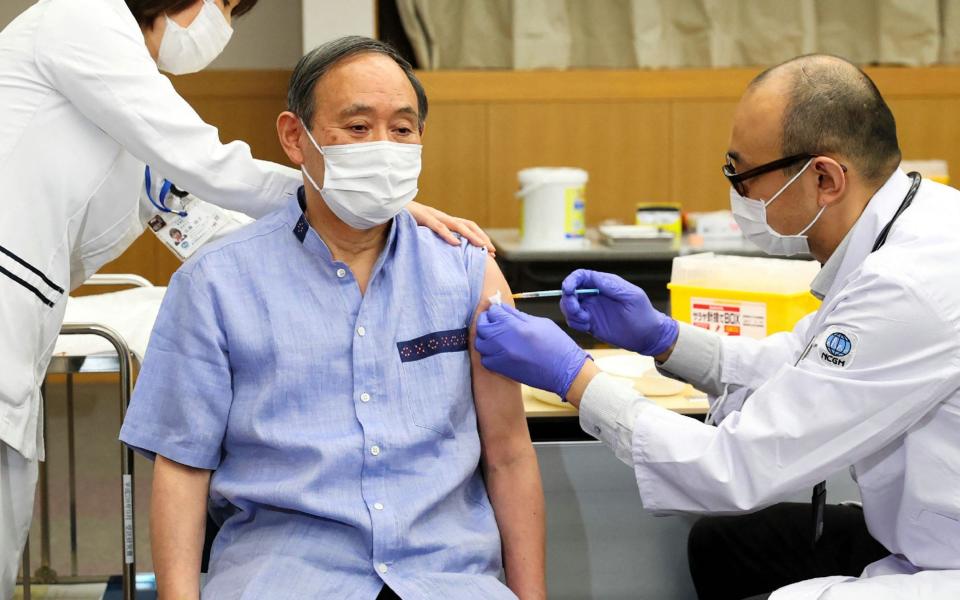 Japan's Prime Minister Yoshihide Suga receives the vaccine  - AFP