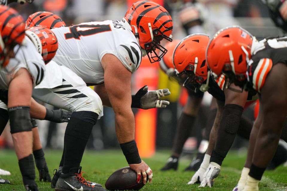 Cincinnati Bengals center Ted Karras (64) gets set to snap the ball in the second quarter of an NFL football game between the Cincinnati Bengals and Cleveland Browns, Sunday, Sept. 10, 2023, at Cleveland Browns Stadium in Cleveland.