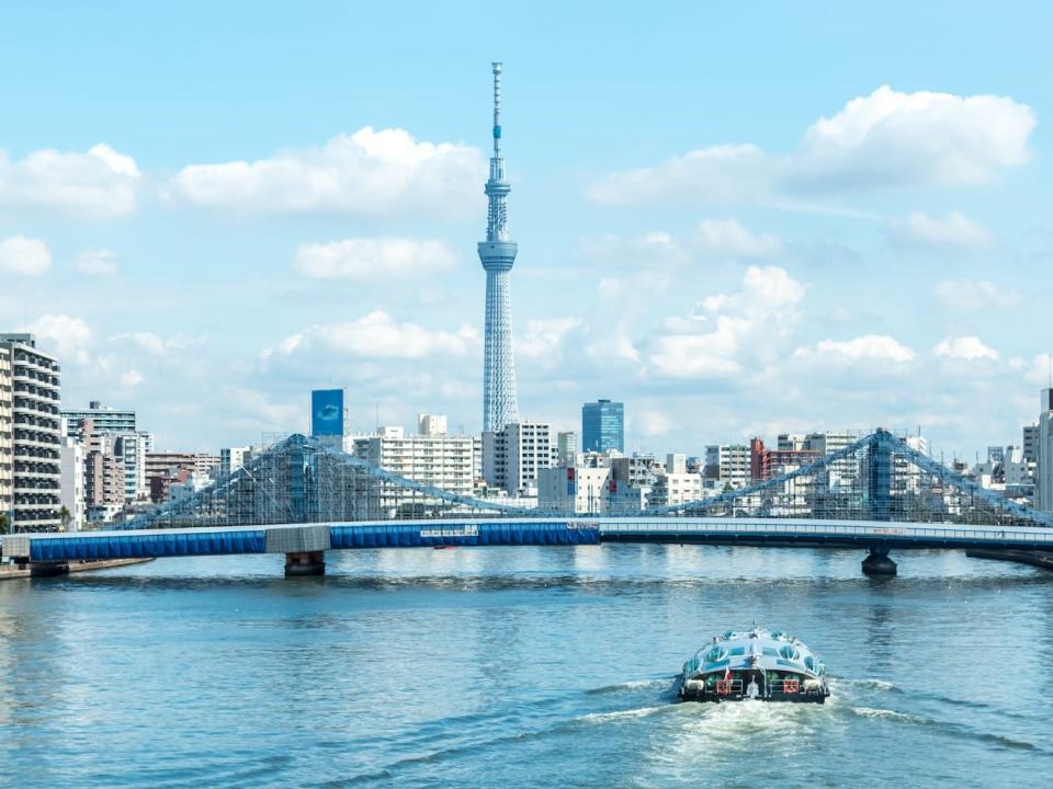 A boat navigates one of Tokyo's rivers.