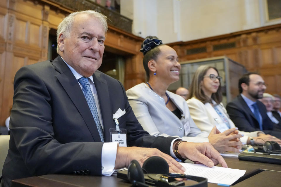 Colombia's agent Eduardo Valencia Ospina and his delegation wait for judges to enter the World Court in The Hague, Netherlands, Thursday, July 13, 2023, where the United Nations' highest court delivers its judgment in a long-running maritime border dispute between Nicaragua and Colombia. (AP Photo/Peter Dejong)