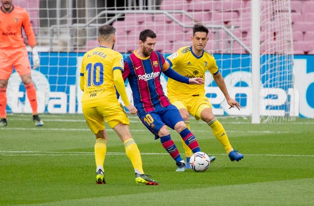 Barcelona’s Lionel Messi (centre) made a record 506th LaLiga appearance for the club against Cadiz