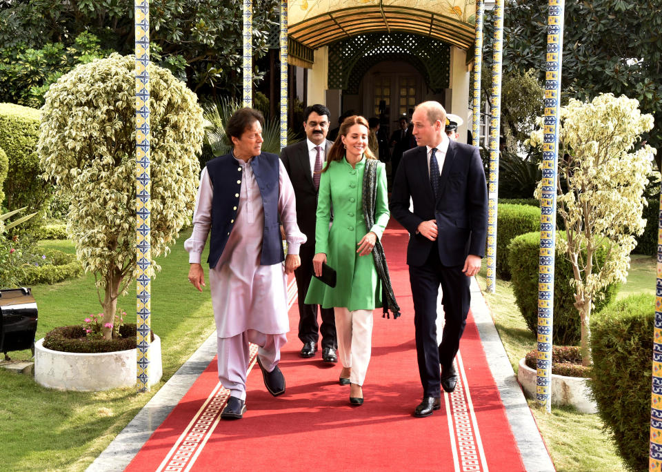 Britain's Prince William, right, and his wife Kate meet Pakistani Prime Minister Imran Khan, left, in Islamabad, Pakistan, Tuesday, Oct. 15, 2019. The royal couple kicked off a five-day tour of Pakistan on Tuesday amid much fanfare and tight security. (AP Photo/Muhammed Ahmed)