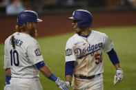 Los Angeles Dodgers' Mookie Betts celebrates a home run against the Tampa Bay Rays during the sixth inning in Game 1 of the baseball World Series Tuesday, Oct. 20, 2020, in Arlington, Texas. (AP Photo/Eric Gay)