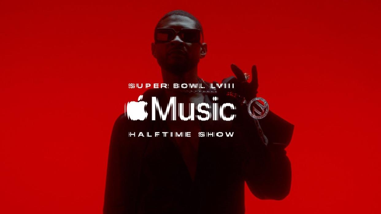  Silhouette of musician Usher against a red background with Apple Music logo in front. 