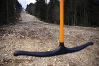 Cable car anchor hangs empty on a ski track without any snow on Bjelasnica mountain near Sarajevo, Bosnia, Wednesday, Jan. 4, 2023. (AP Photo/Armin Durgut)