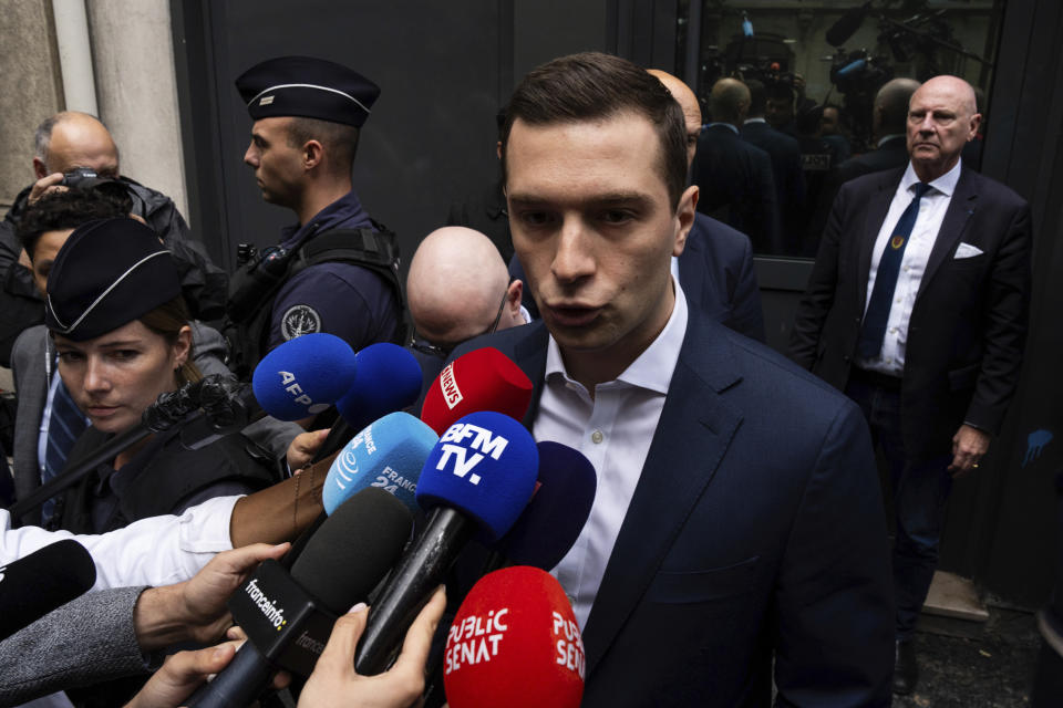 Jordan Bardella, president of the French far-right National Rally party, answers reporters outside the party headquarters, Monday, July 1, 2024 in Paris. France's National Rally surged into the lead in the first round of legislative elections, according to results released early Monday, bringing the far-right party to the brink of power and dealing a major blow to President Emmanuel Macron's centrists in an election that could set the country, and Europe, on a starkly different course. (AP Photo/Louise Delmotte)