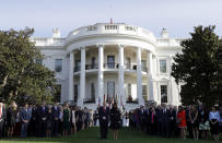 <p>President Trump and first lady Melania Trump stand for a moment of silence to mark the anniversary of the Sept. 11 terrorist attacks, on the South Lawn of the White House, Monday, Sept. 11, 2017, in Washington. (Photo: Evan Vucci/AP) </p>