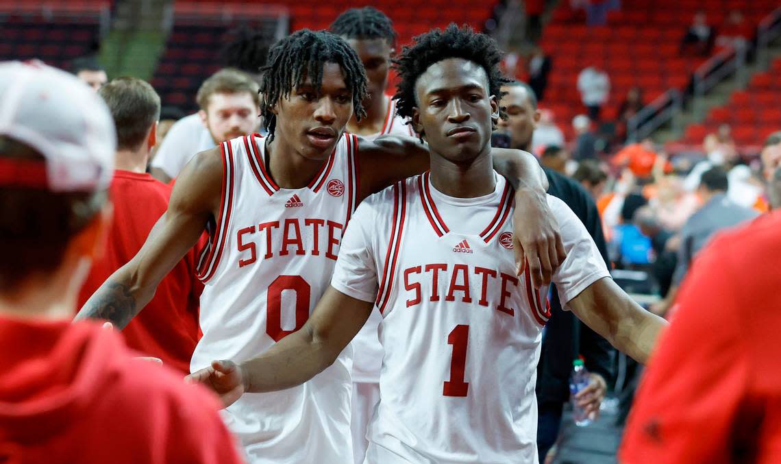 N.C. State’s Terquavion Smith (0) and Jarkel Joiner (1) walk off the court after Clemson’s 96-71 victory over N.C. State’s game at PNC Arena in Raleigh, N.C., Saturday, Feb. 25, 2023.
