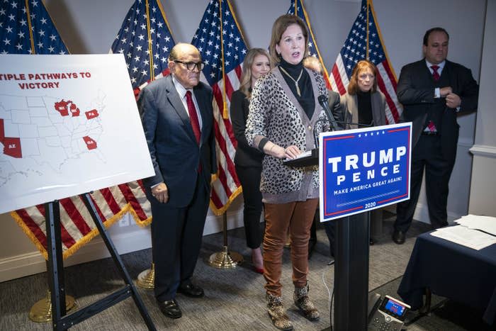 Sidney Powell (front) speaks at a news conference with Rudy Giuliani (left) on Nov. 19, 2020.