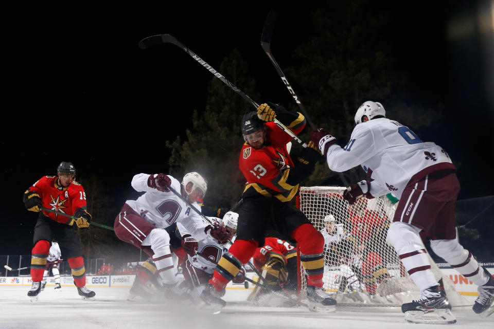 <p>Alec Martinez #23 of the Vegas Golden Knights battles for position with Nazem Kadri #91 of the Colorado Avalanche as Gabriel Landeskog #92 and Mikko Rantanen #96 attempt to score on goaltender Marc-Andre Fleury #29 during the second period of the 'NHL Outdoors At Lake Tahoe' at the Edgewood Tahoe Resort on February 20, 2021 in Stateline, Nevada. (Photo by Christian Petersen/Getty Images)</p> 